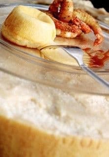 Hot Parmigiano Reggiano heart with crayfish tails and red wine sauce